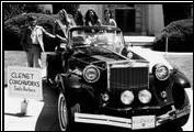 Beauty pageant winners grace an equally beautiful automobile, a Clenet Series II Asha.