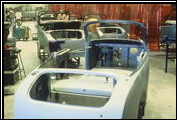A Clenet Series II comes out of the body shop, awaiting paint.