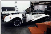 A Series III Clenet is prepared for trunk, hood, side pipes, and grill installations.